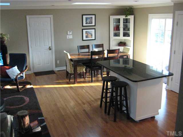 1700 Su John Road Raleigh, NC 27607 - Photo 6 of 18 a view of a dining room with furniture and wooden floor