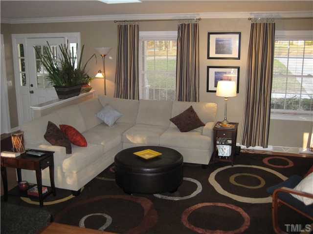1700 Su John Road Raleigh, NC 27607 - Photo 8 of 18 a living room with furniture and a potted plant