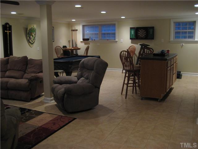1700 Su John Road Raleigh, NC 27607 - Photo 9 of 18 a living room with furniture and a flat screen tv
