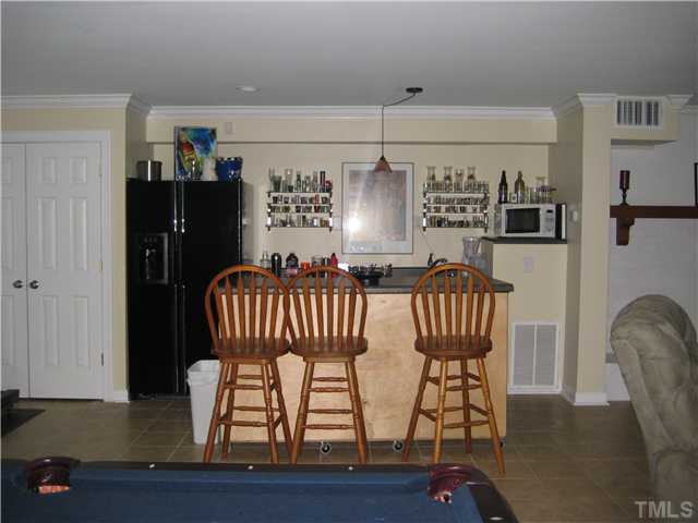 1700 Su John Road Raleigh, NC 27607 - Photo 10 of 18 a view of a dining room with furniture and wooden floor