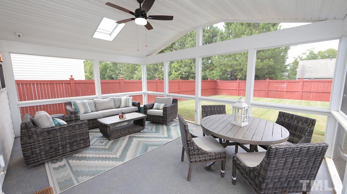 5410 Wind Mountain Lane Raleigh, NC 27613 - Photo 12 of 13 a living room with furniture and a large window