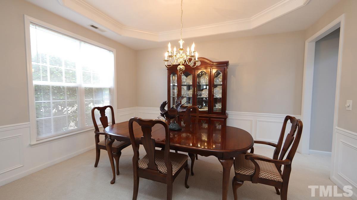 5410 Wind Mountain Lane Raleigh, NC 27613 - Photo 6 of 13 a view of a dining room with furniture and window