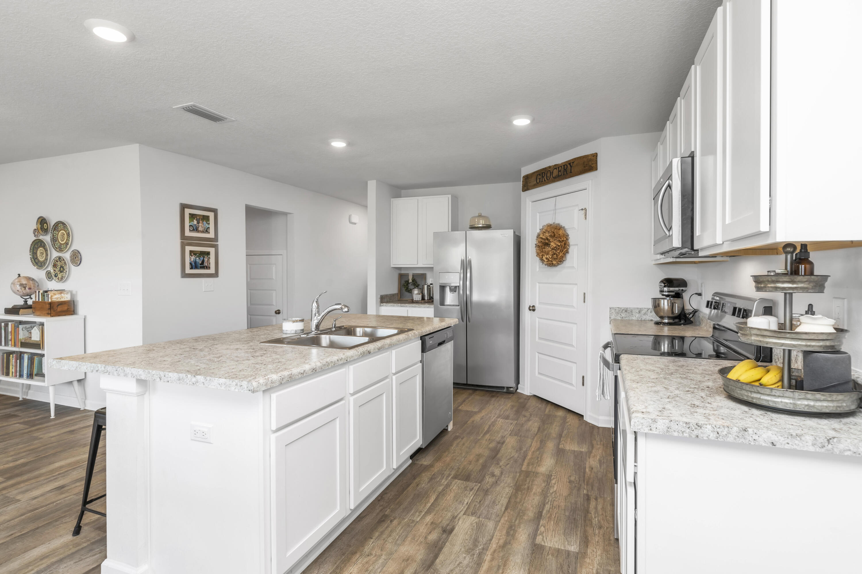 162 This Way Freeport, FL 32439 - Photo 14 of 55 a kitchen with a sink a stove cabinets and counter space