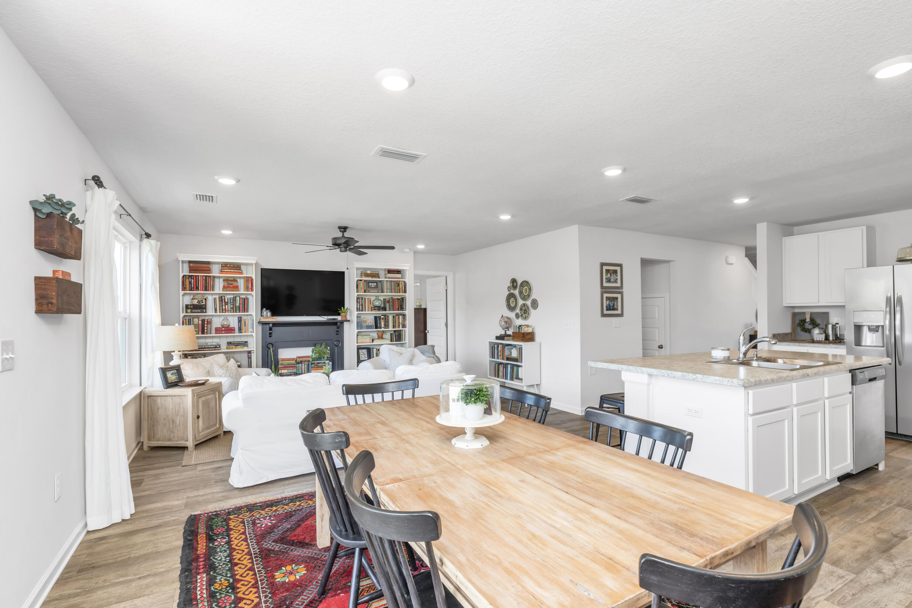 162 This Way Freeport, FL 32439 - Photo 19 of 55 a large living room with stainless steel appliances furniture a rug and a kitchen view