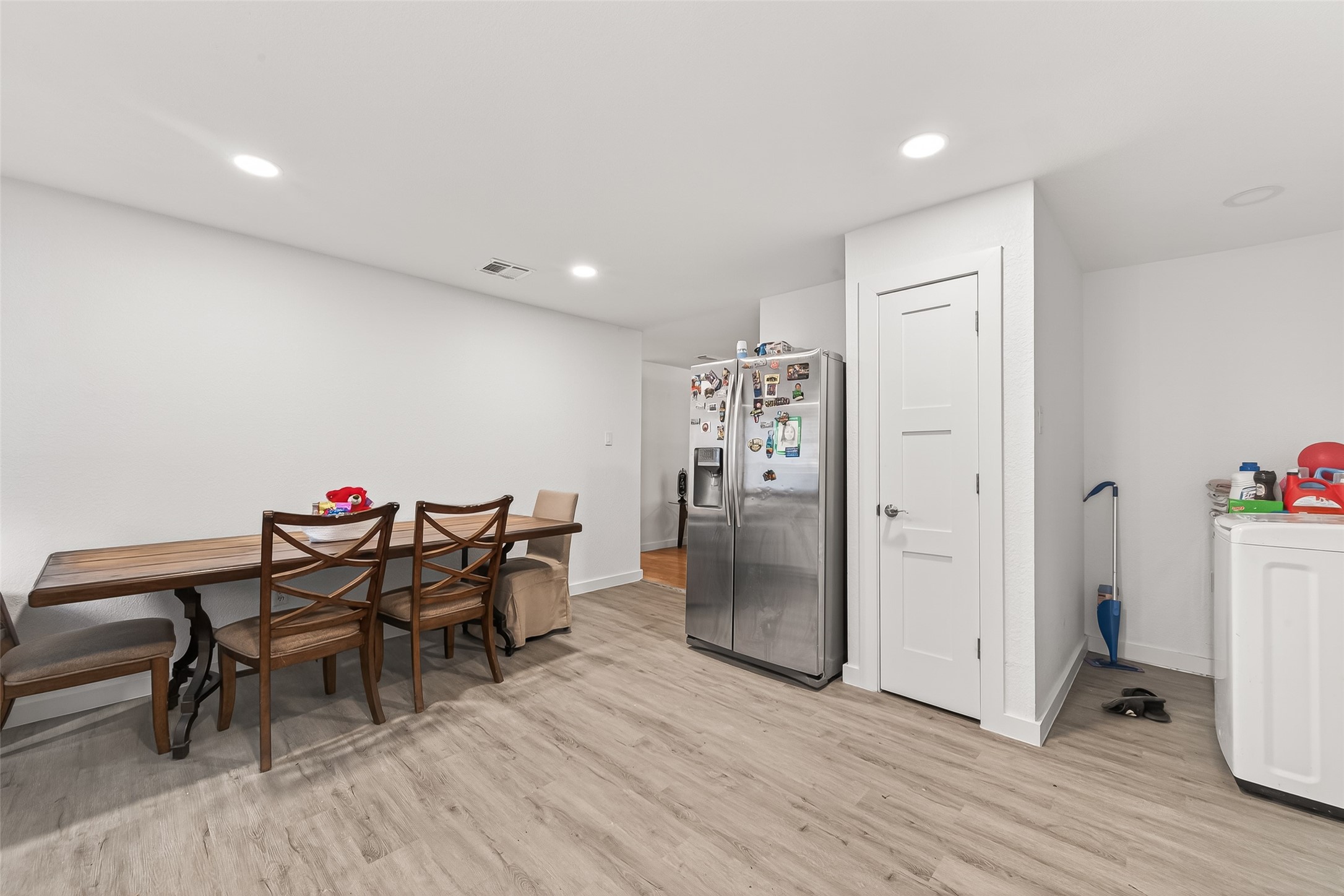 229 Austin Street Angleton, TX 77515 - Photo 16 of 36 a view of a room with furniture and wooden floor