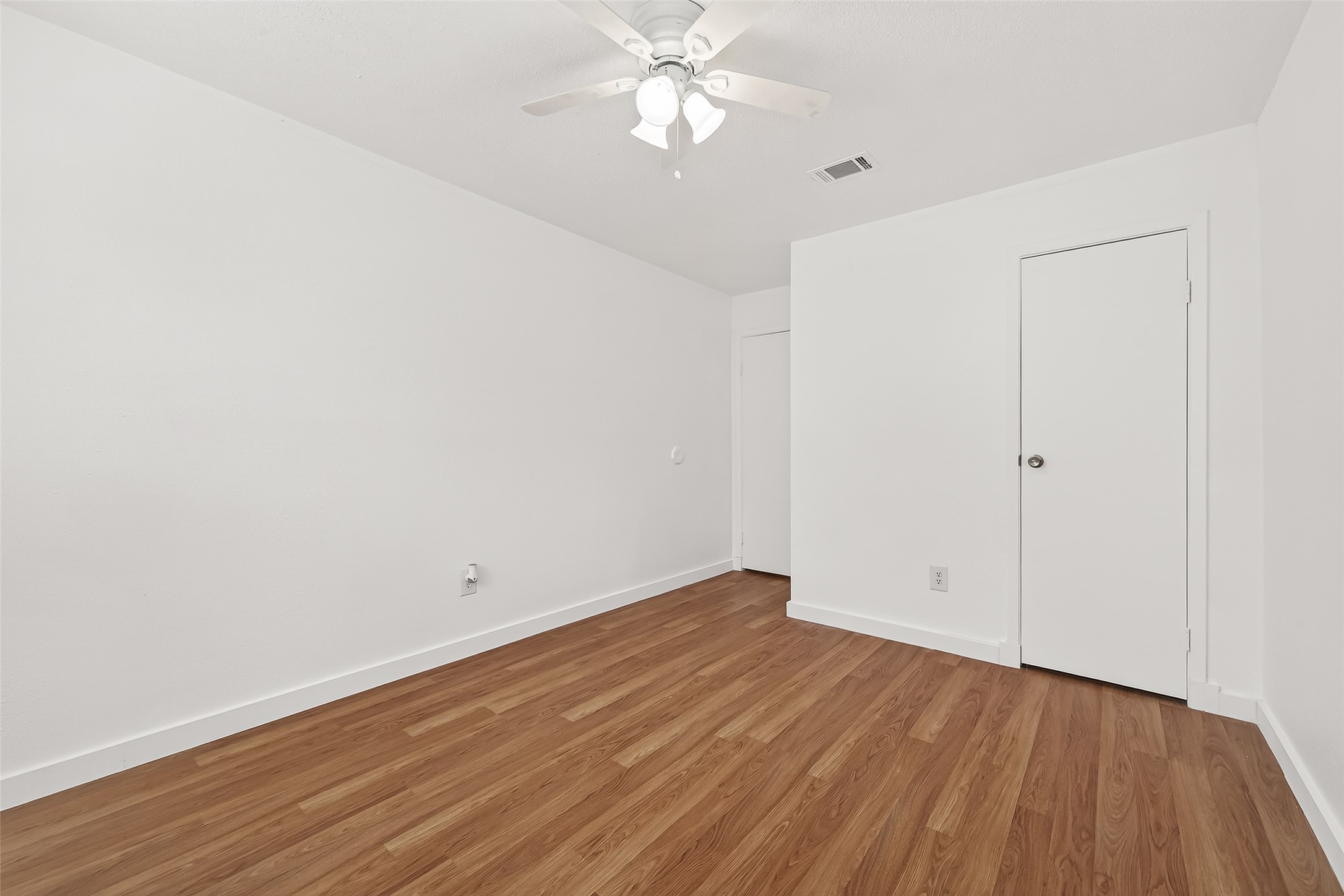 229 Austin Street Angleton, TX 77515 - Photo 20 of 36 wooden floor in an empty room
