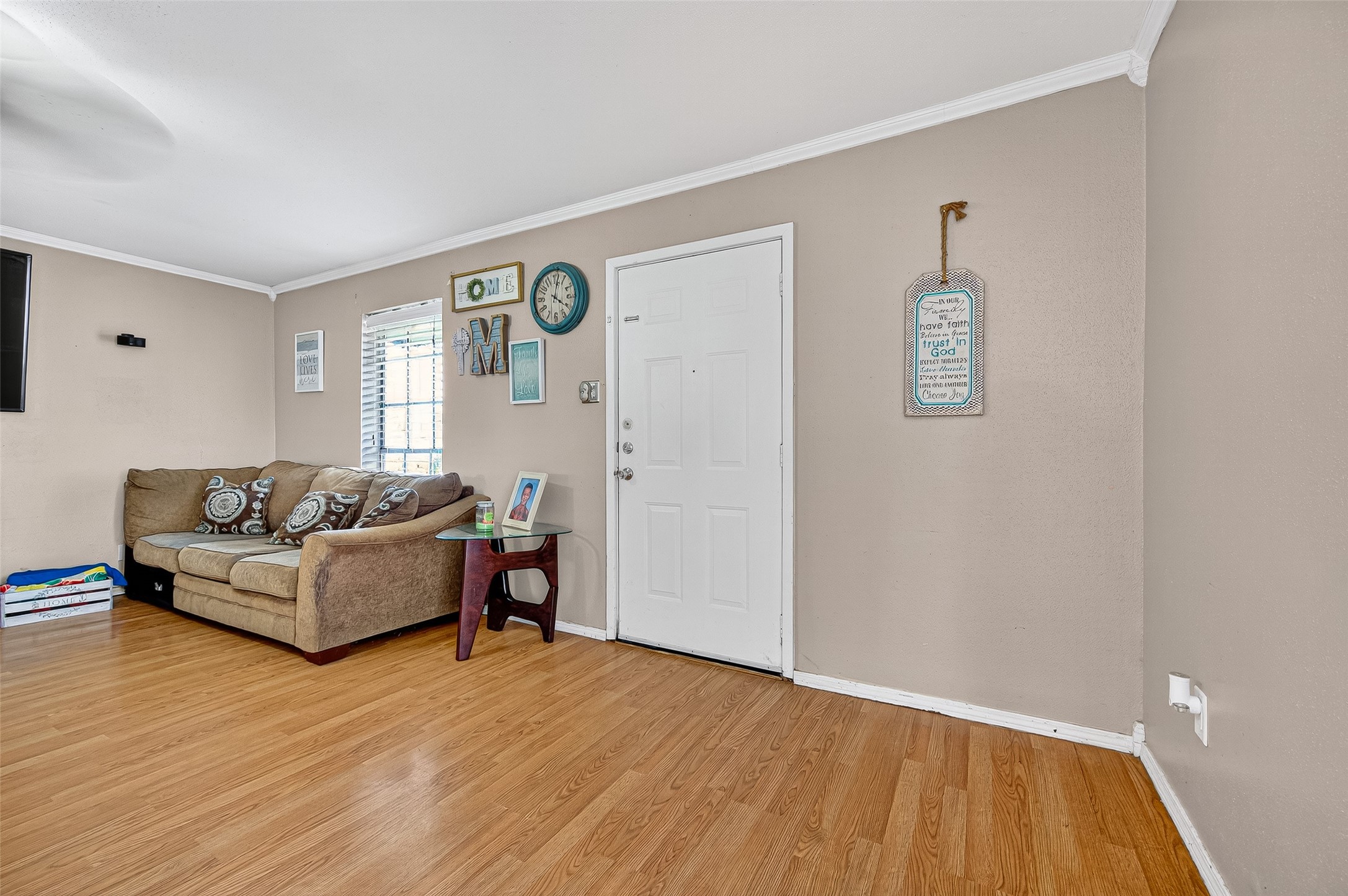 229 Austin Street Angleton, TX 77515 - Photo 4 of 36 Open living area with wood flooring throughout