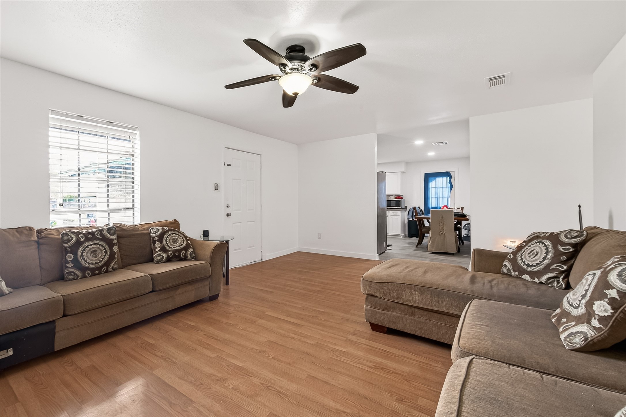 229 Austin Street Angleton, TX 77515 - Photo 8 of 36 a living room with furniture window and a couch