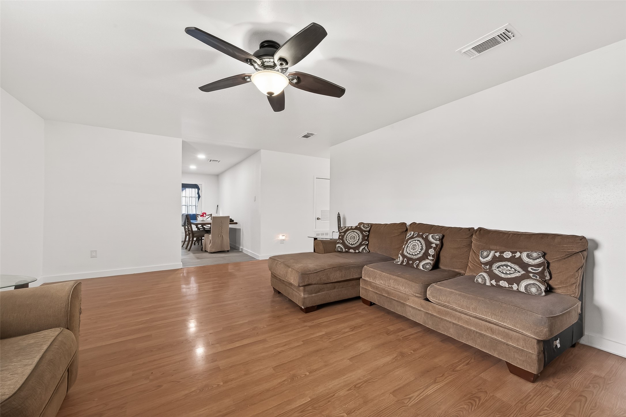 229 Austin Street Angleton, TX 77515 - Photo 9 of 36 a living room with furniture and view of kitchen