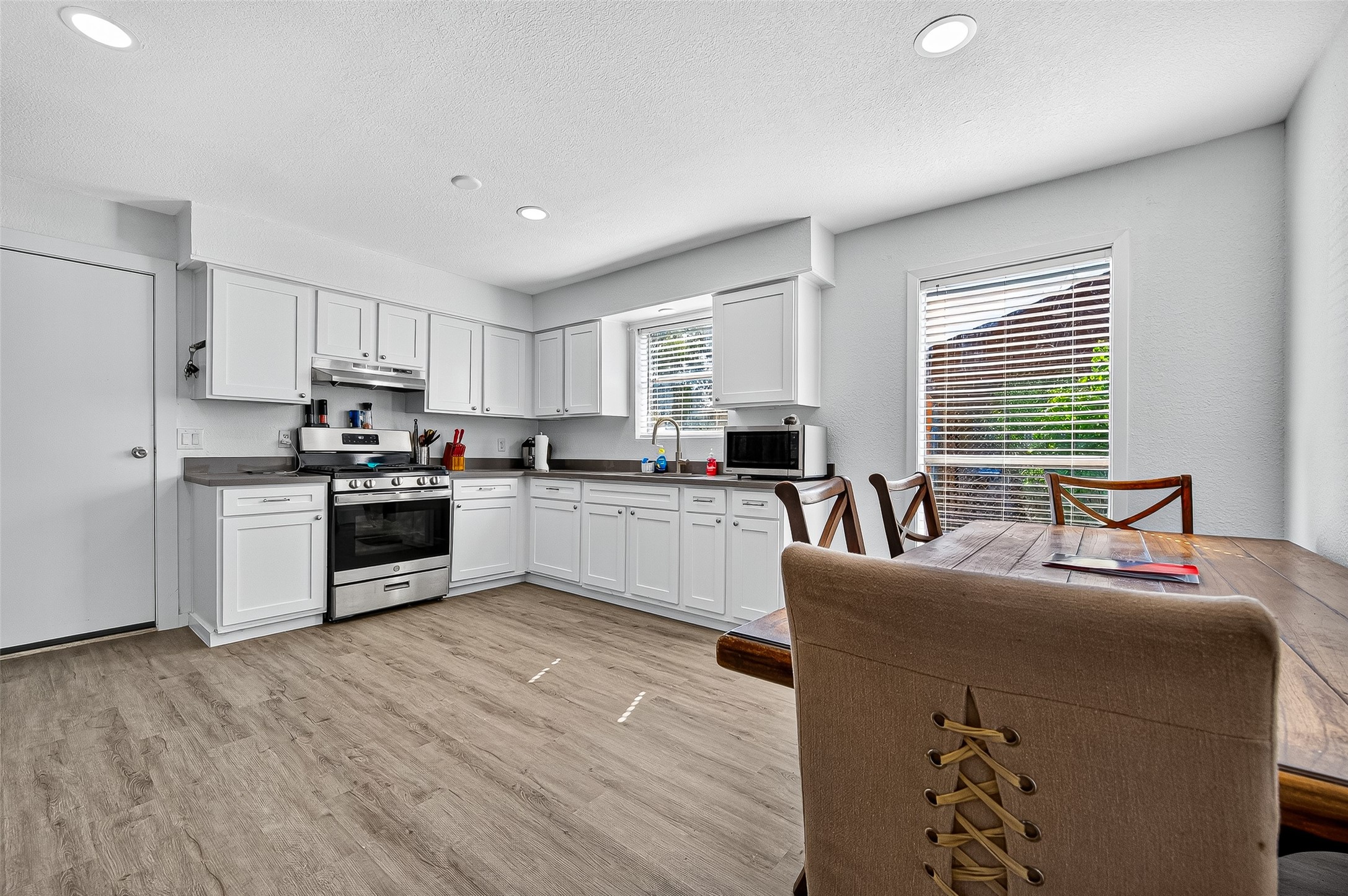 229 Austin Street Angleton, TX 77515 - Photo 9 of 36 Kitchen is open concept