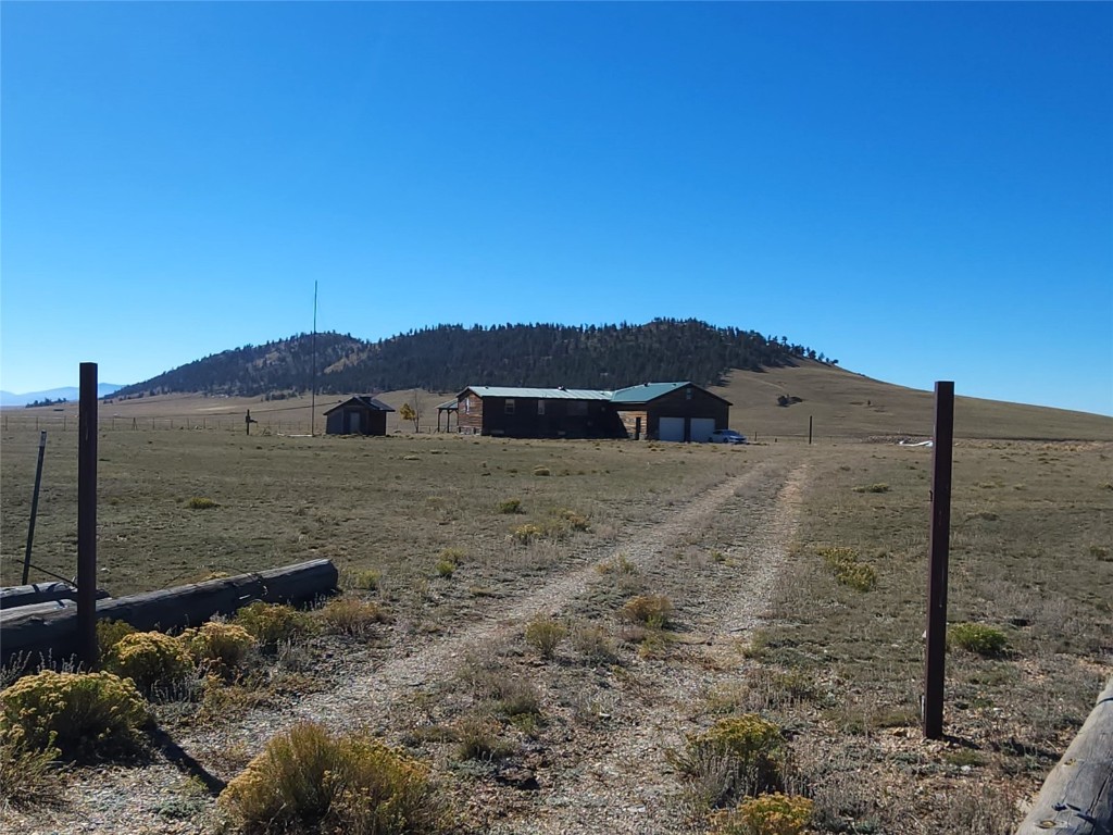 6558 Rio Blanco Road Hartsel, CO 80449 - Photo 11 of 40 a view of a dry yard with wooden fence