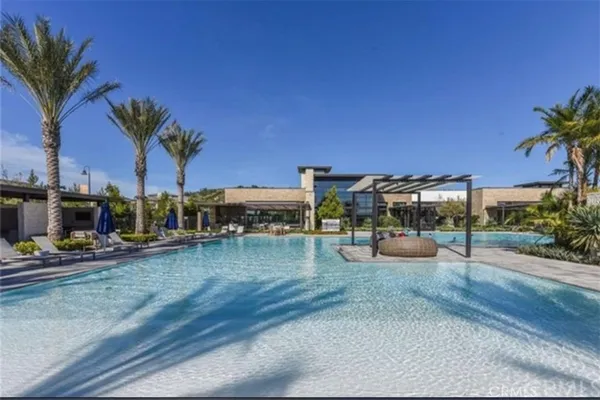 a view of swimming pool with outdoor seating