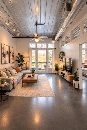 a living room with furniture and a chandelier