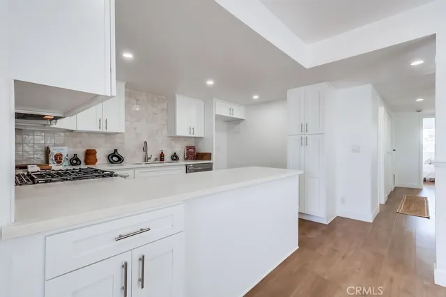 a view of kitchen with wooden floor