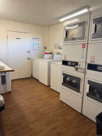 a kitchen with a stove and white cabinets
