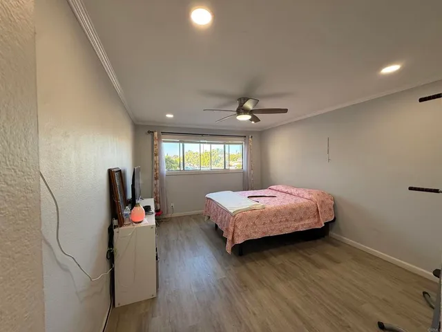 a bedroom with bed and a window