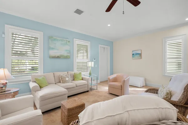 a bedroom with furniture and a large window