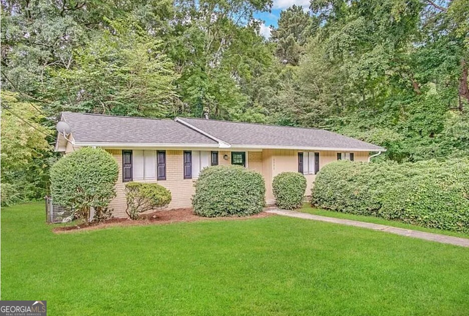 4505 Wonder Valley Trail Decatur, GA 30034 - Photo 1 of 24 a front view of a house with a yard