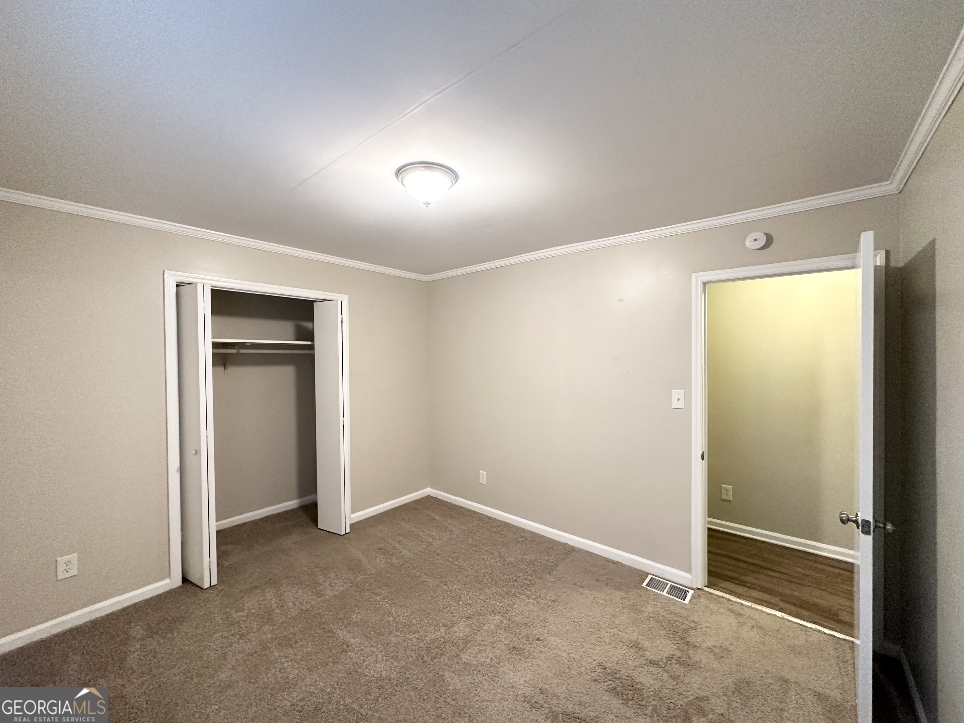 4505 Wonder Valley Trail Decatur, GA 30034 - Photo 12 of 24 an empty room with closet and a window