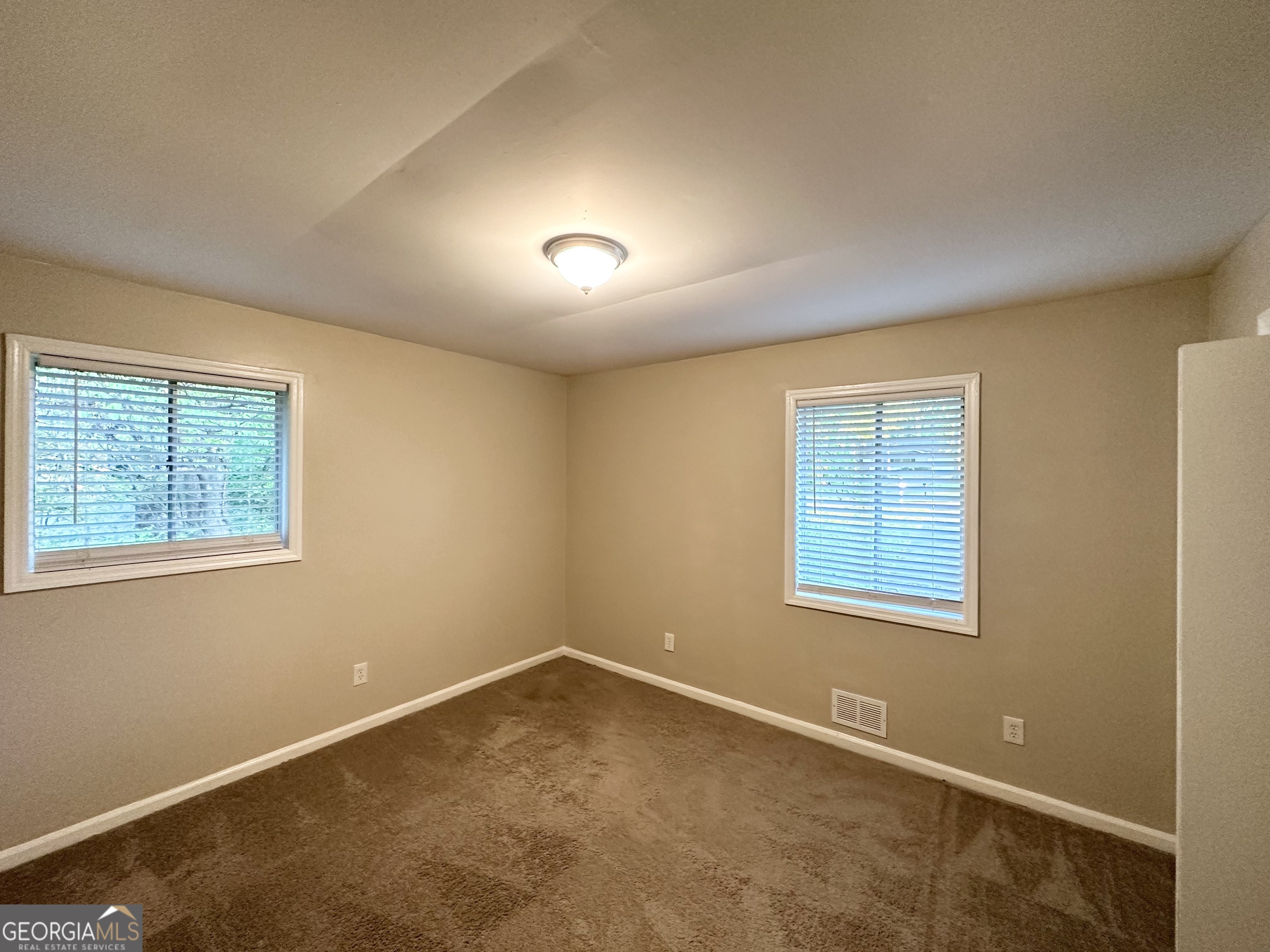 4505 Wonder Valley Trail Decatur, GA 30034 - Photo 13 of 24 an empty room with a empty space and windows
