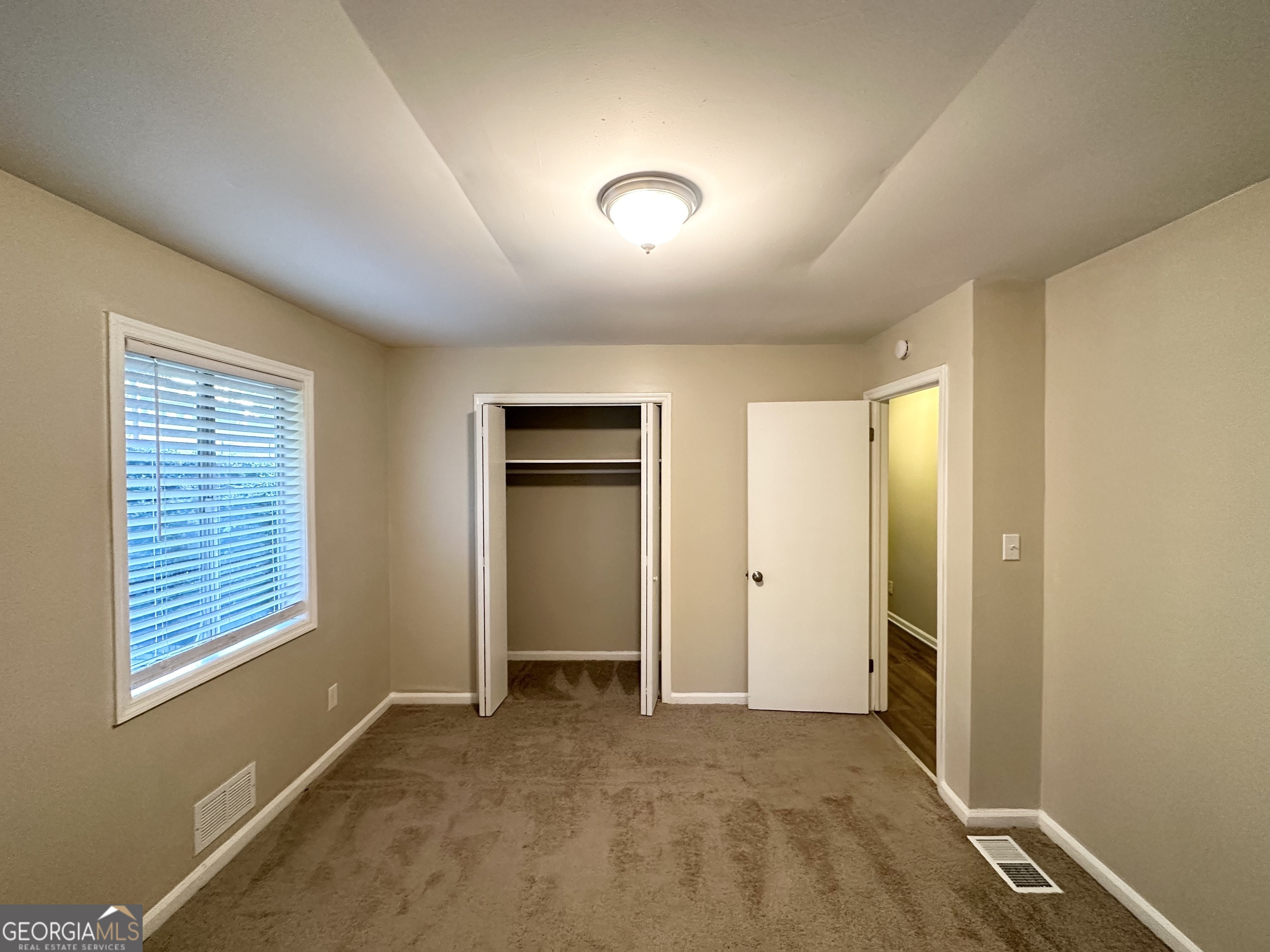 4505 Wonder Valley Trail Decatur, GA 30034 - Photo 14 of 24 an empty room with windows and closet