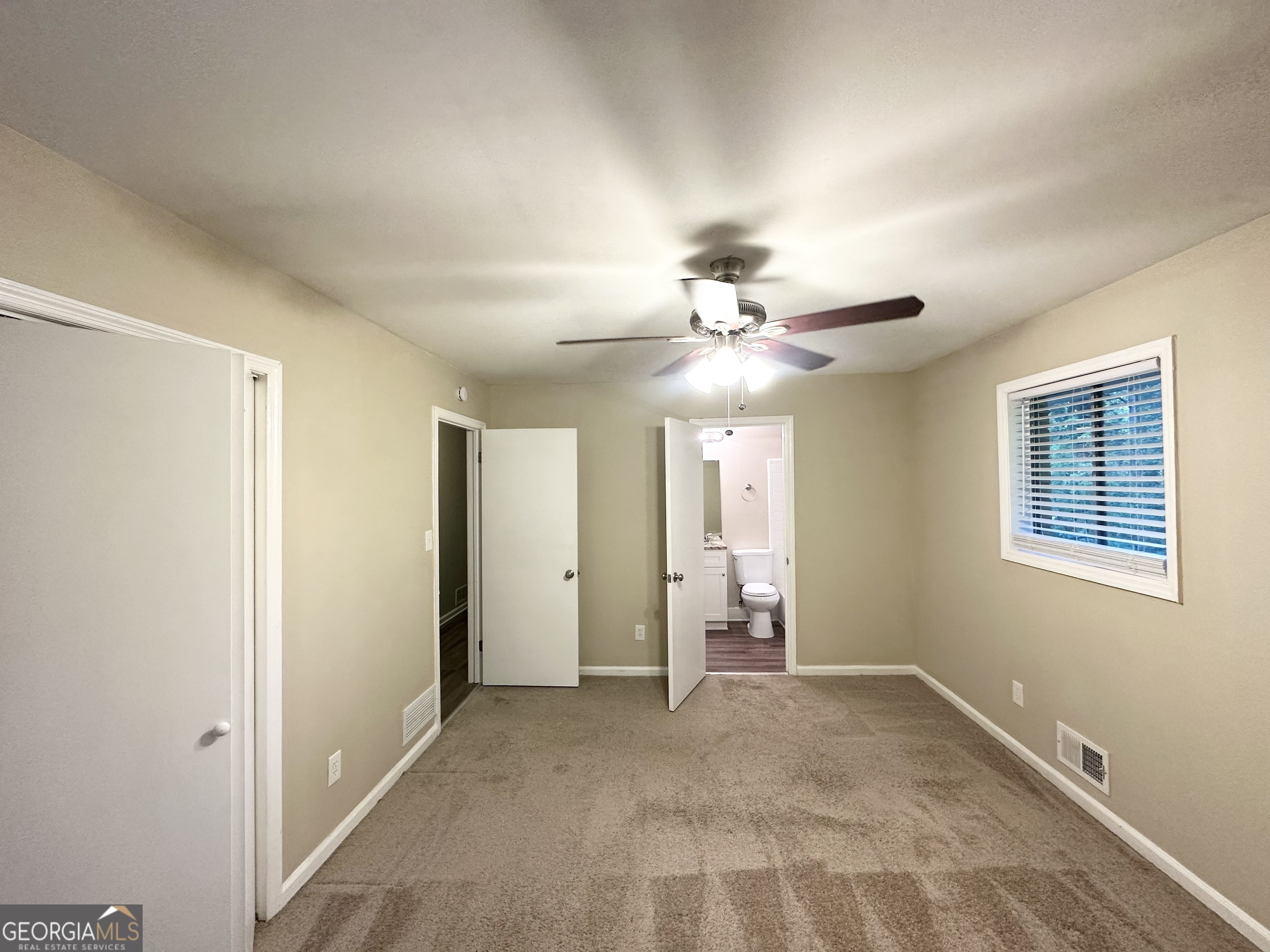 4505 Wonder Valley Trail Decatur, GA 30034 - Photo 16 of 24 a view of a livingroom with a ceiling fan and window