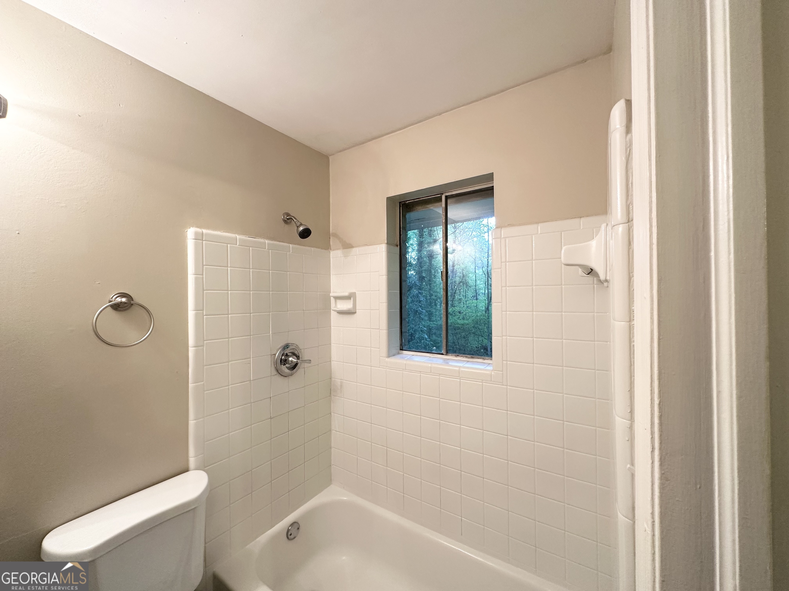 4505 Wonder Valley Trail Decatur, GA 30034 - Photo 18 of 24 a bathroom with a shower a bathtub and toilet