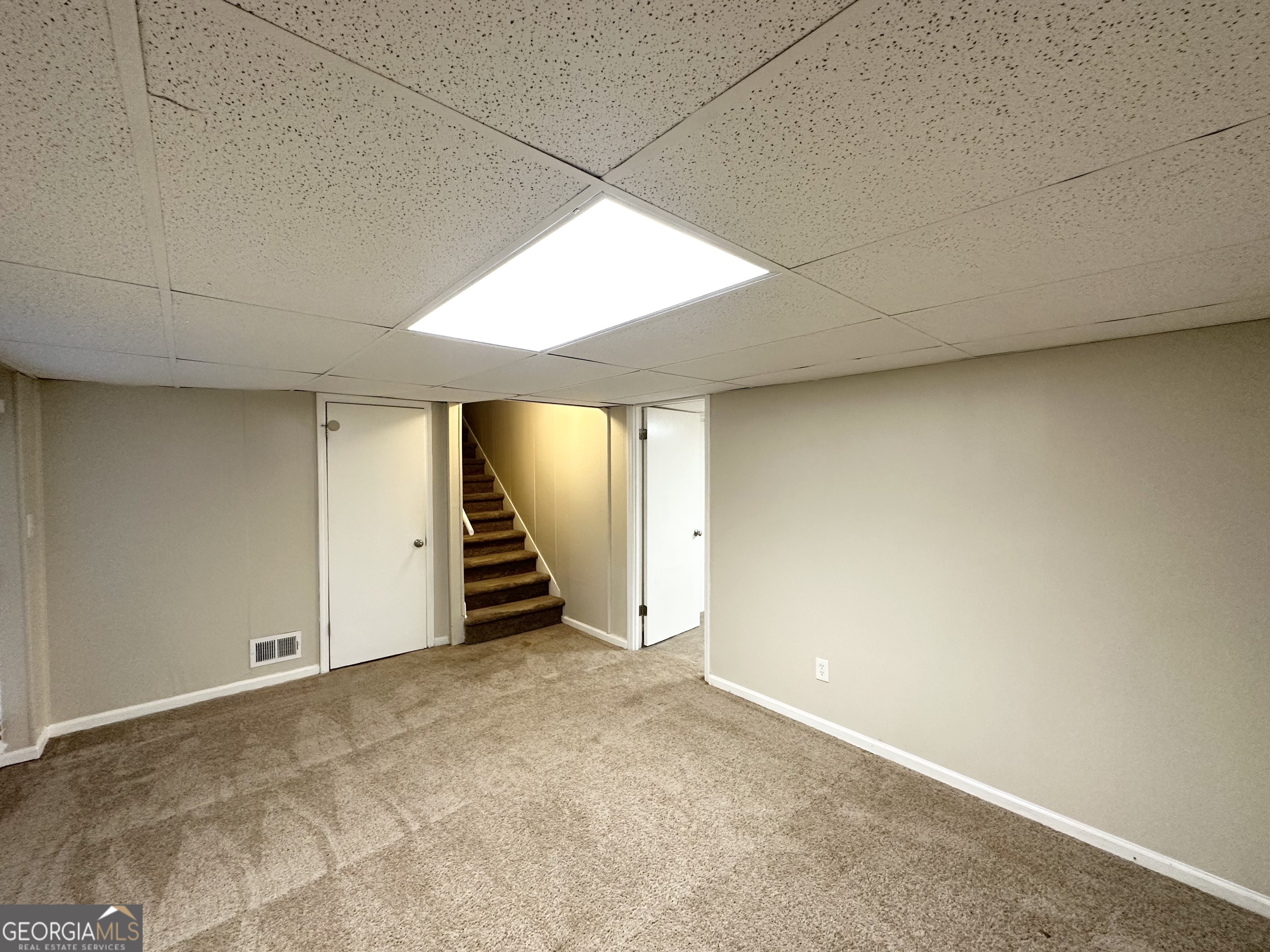 4505 Wonder Valley Trail Decatur, GA 30034 - Photo 21 of 24 an empty room with a window and a ceiling fan