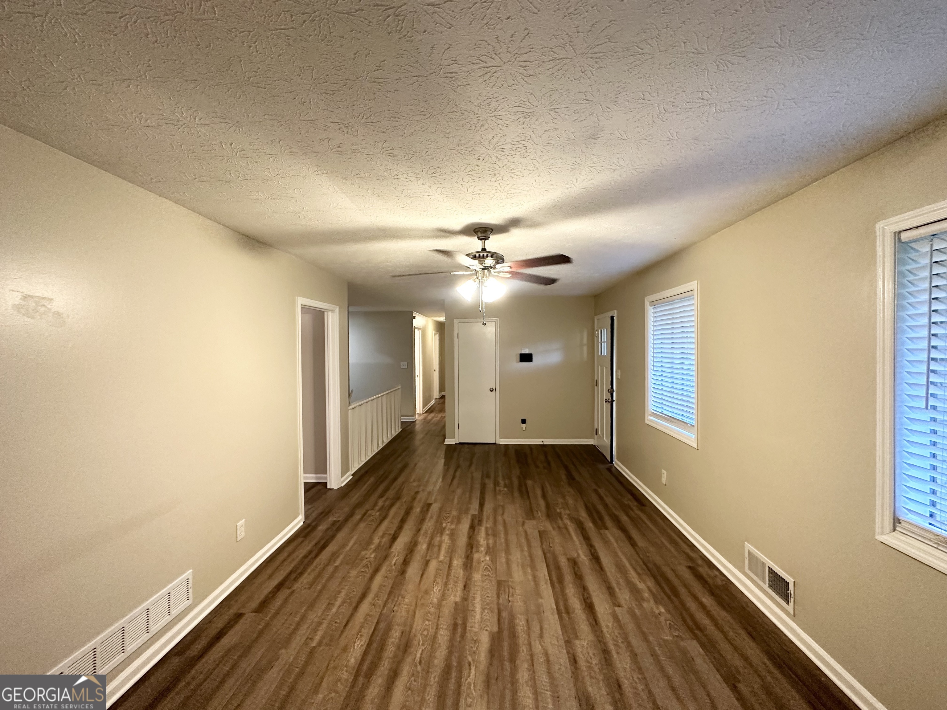 4505 Wonder Valley Trail Decatur, GA 30034 - Photo 4 of 24 wooden floor in an empty room with a window