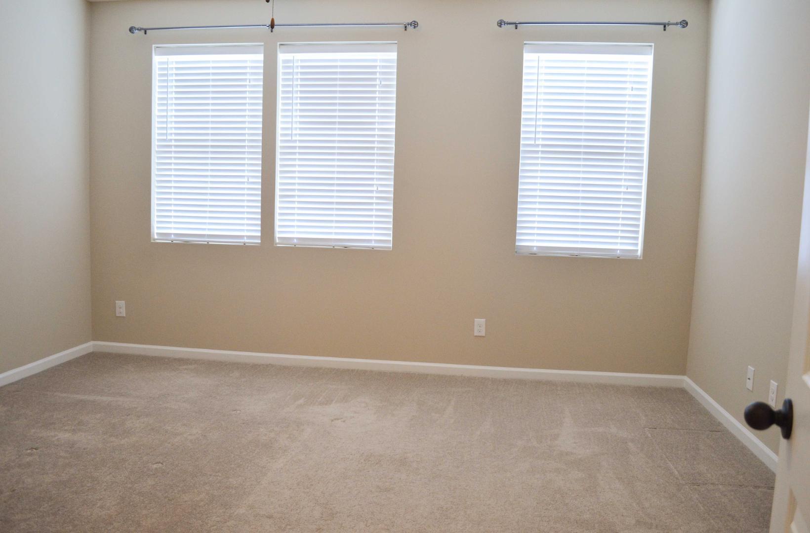 720 Wickham Ridge Road Apex, NC 27539 - Photo 12 of 24 a view of an empty room with a window