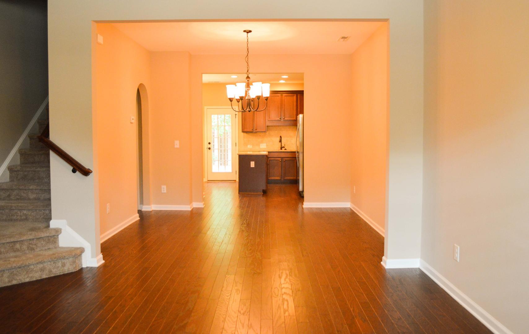 720 Wickham Ridge Road Apex, NC 27539 - Photo 5 of 24 a view of a living room with wooden floor