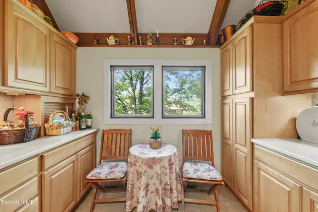 a kitchen with furniture and window