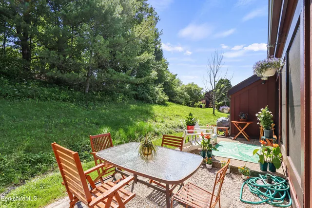 a backyard of a house with outdoor seating