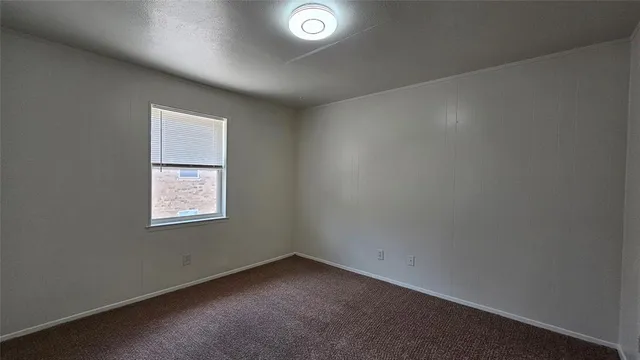 an empty room with closet area