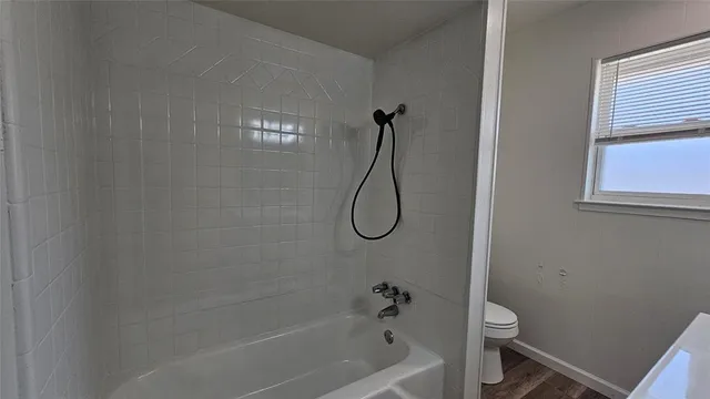 a bathroom with a sink and a window