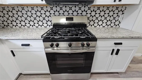 a kitchen with granite countertop cabinets and a sink