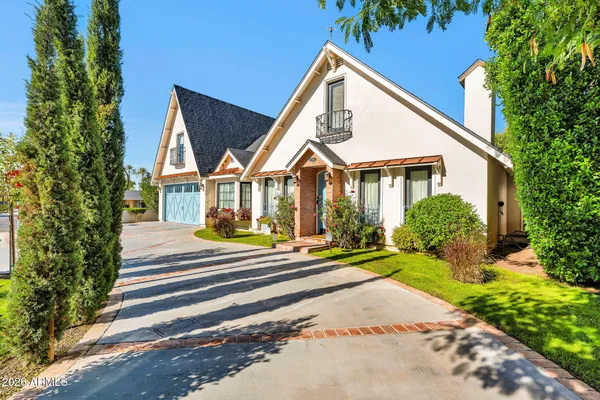 a view of a house with a yard and plants