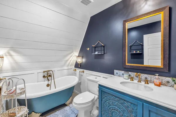 a work room with furniture and potted plants