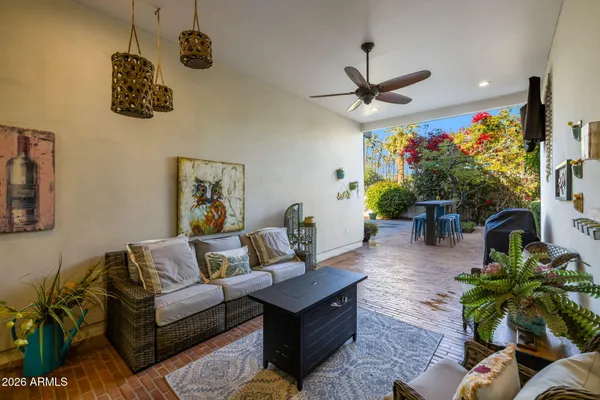 a living room with furniture and a large window