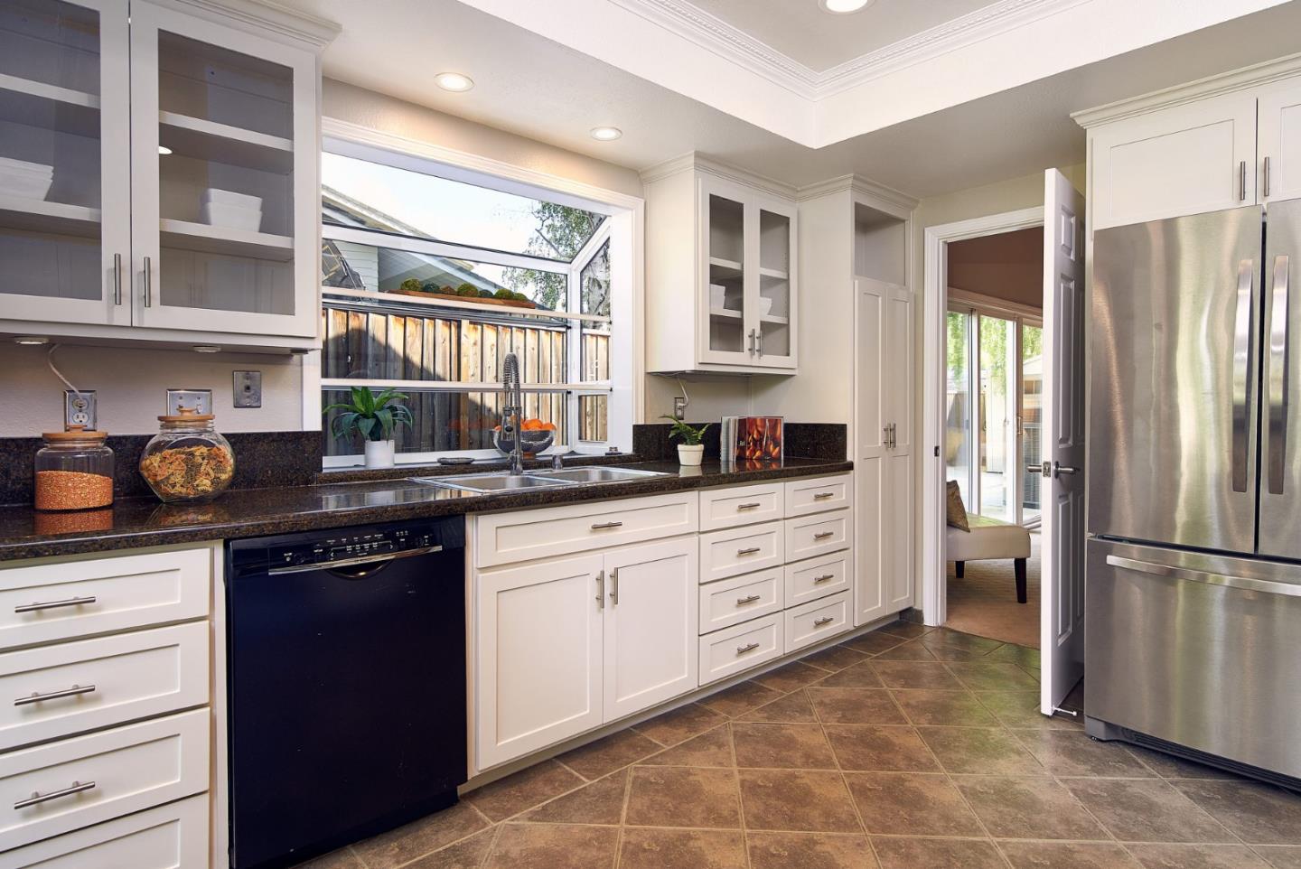 2522 Corte Bella Pleasanton, CA 94566 - Photo 13 of 29 a kitchen with a refrigerator and cabinets