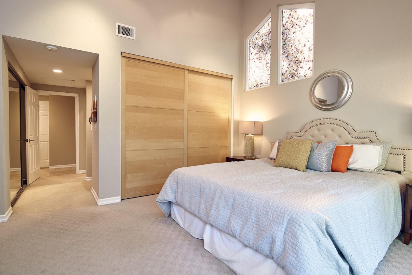 2522 Corte Bella Pleasanton, CA 94566 - Photo 16 of 29 a bedroom with a bed and a chandelier