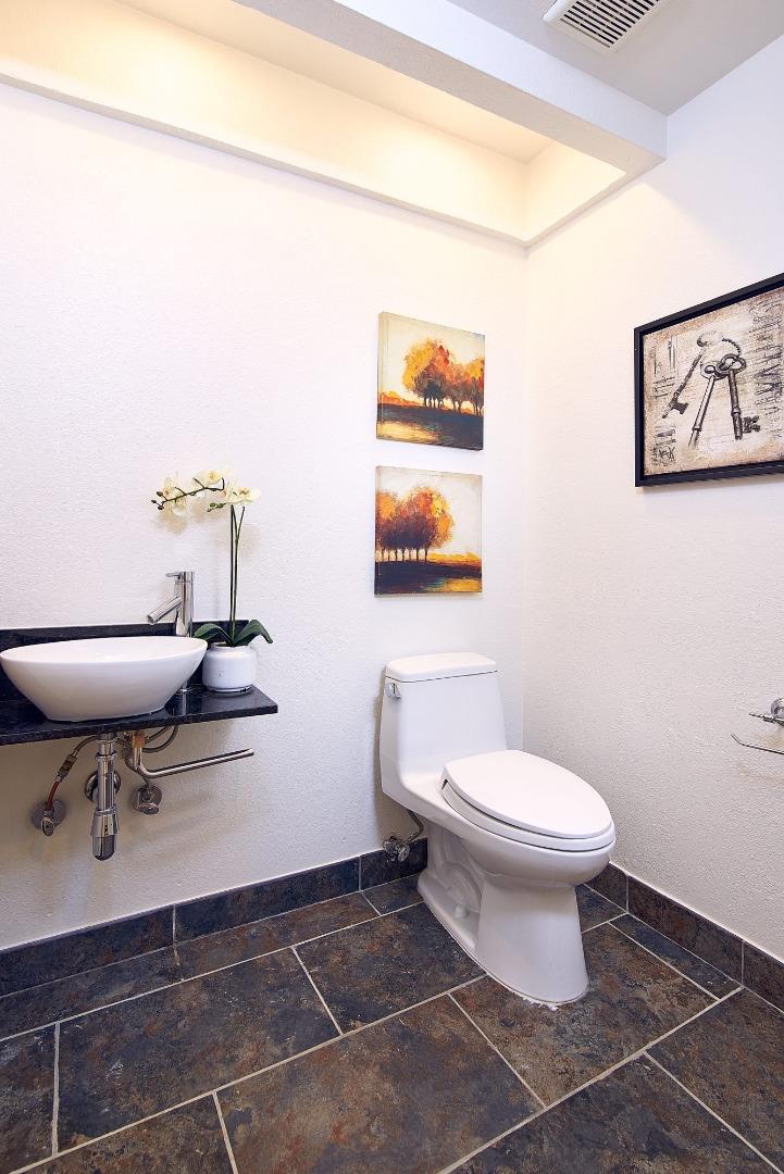 2522 Corte Bella Pleasanton, CA 94566 - Photo 23 of 29 a bathroom with a toilet a sink and a mirror