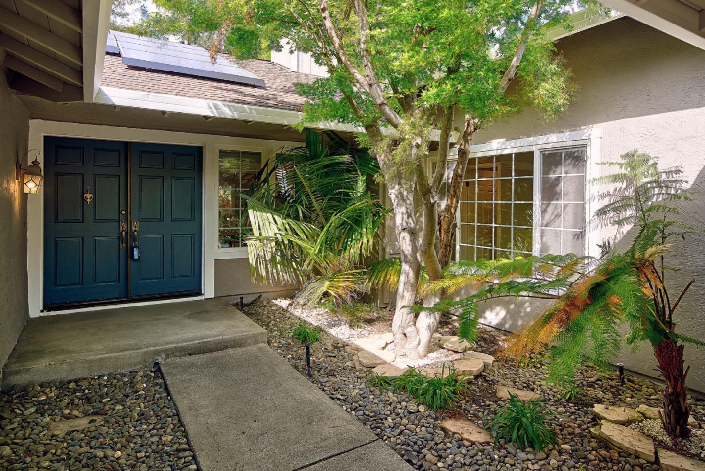2522 Corte Bella Pleasanton, CA 94566 - Photo 3 of 29 a backyard of a house with potted plants and large tree