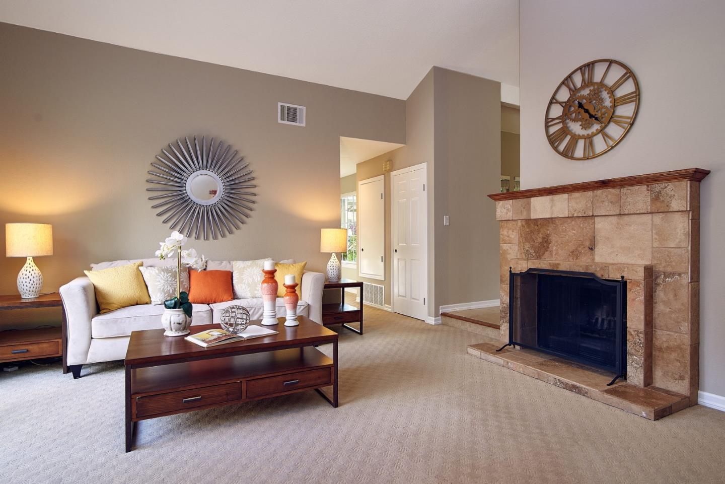2522 Corte Bella Pleasanton, CA 94566 - Photo 7 of 29 a living room with furniture a clock and a fireplace
