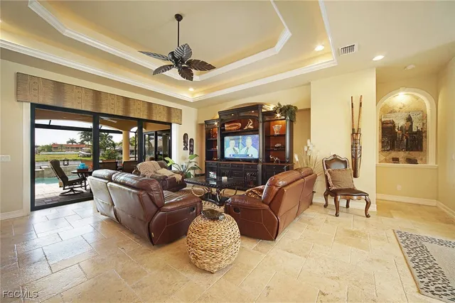 a kitchen with a sink refrigerator and cabinets
