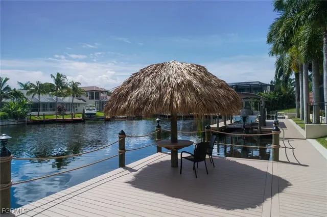 a view of a swimming pool with furniture