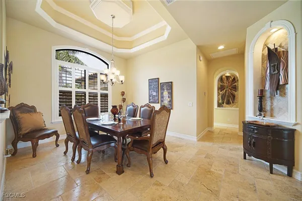 a dining room with furniture and window