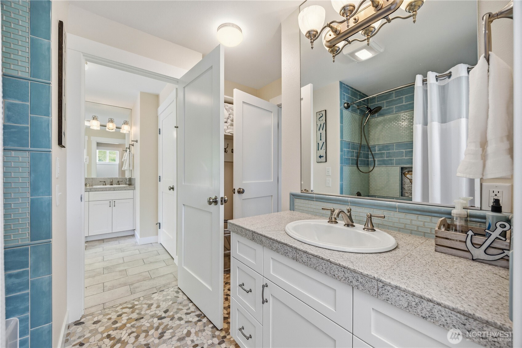 141 Sunset Place Manson, WA 98831 - Photo 21 of 38 a bathroom with a sink double vanity granite tub and shower