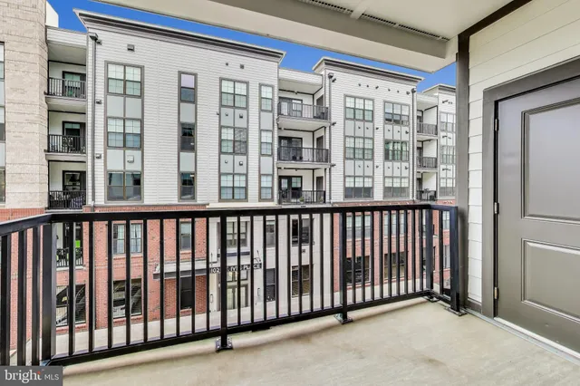 a view of a balcony with a floor to ceiling window