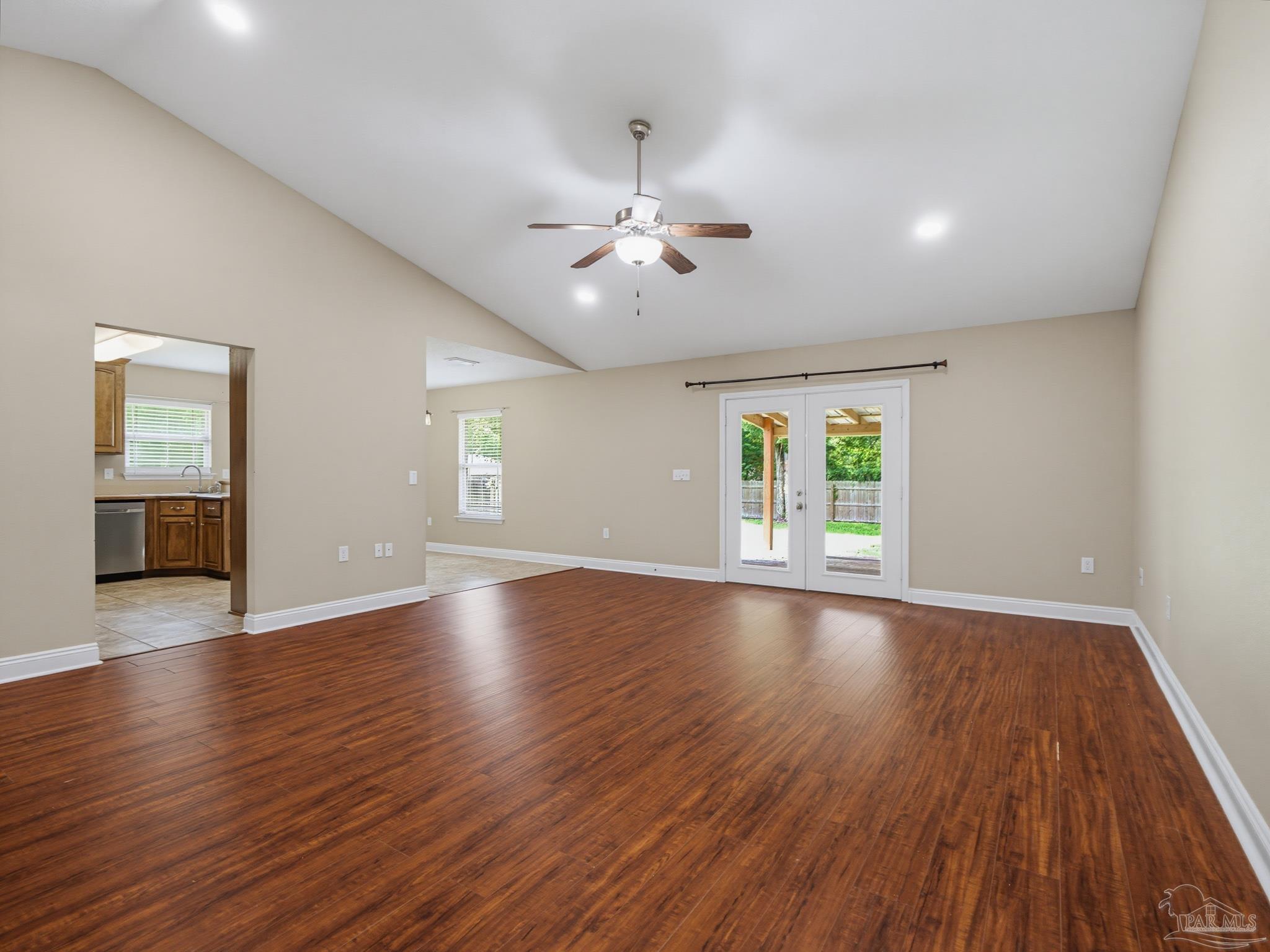 5567 Jones Street Milton, FL 32570 - Photo 10 of 48 a view of empty room with wooden floor and fan